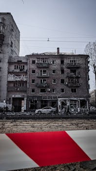 Image of a bomb-damaged residential building in Kyiv, Ukraine, highlighting wartime devastation.